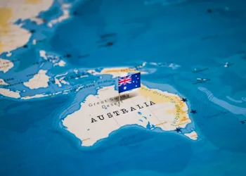 Pinned flag of Australia on map as part of crypto story about the country