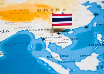 Flag marking Thailand on map of Asia.
