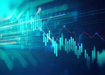 A digital graphic shows a futuristic financial chart with blue and red lines and green bar graphs, representing fluctuating stock market data, on a blue abstract background.