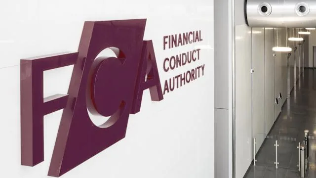 A wall with a large maroon Financial Conduct Authority (FCA) logo and text, next to a modern hallway with white walls and ceiling lights.