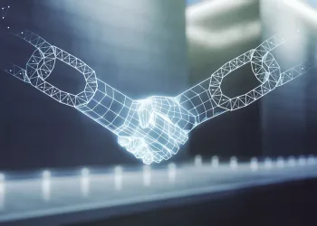 Digital picture of two robotic-looking hands shaking to illustrate an article about the consensus mechanism in blockchain.
