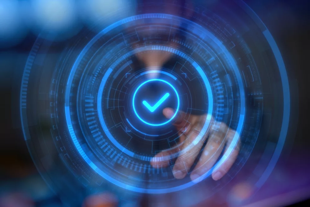 Digital image with tick in the middle accompanying article about blockchain validation.