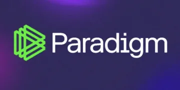 The image shows the Paradigm logo, featuring a green geometric symbol next to the word Paradigm in white text on a dark blue and purple background.