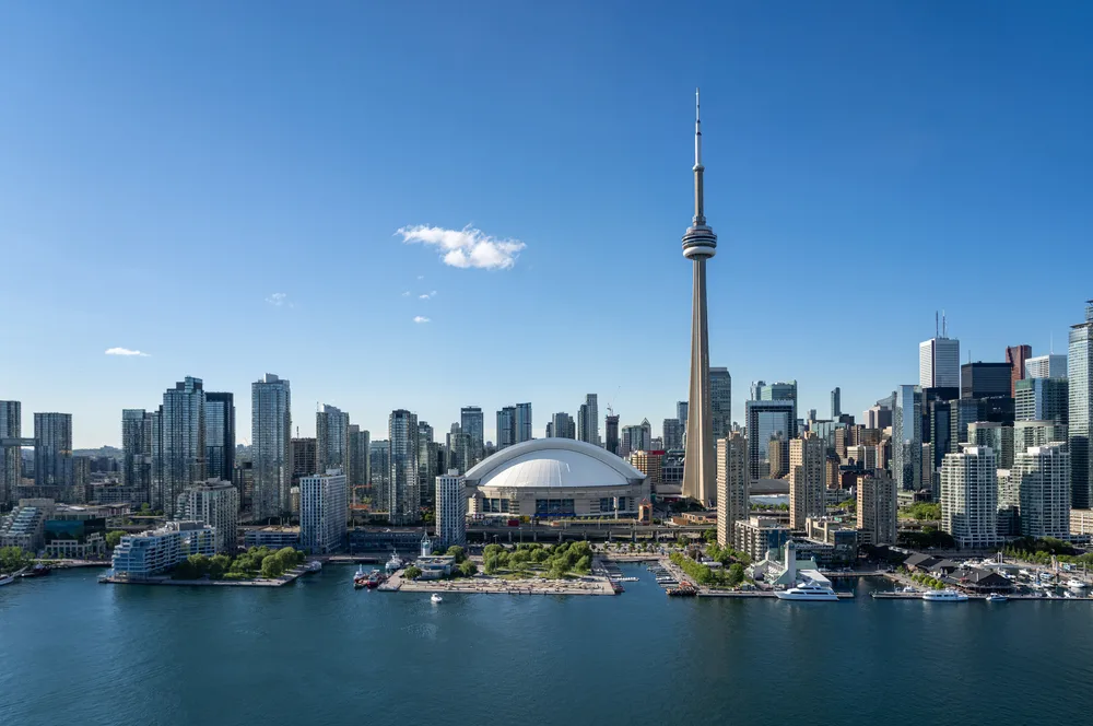 Image of Toronto's skyline by day featuring the CN Tower, used to accompany an article about crypto usage in Canada.