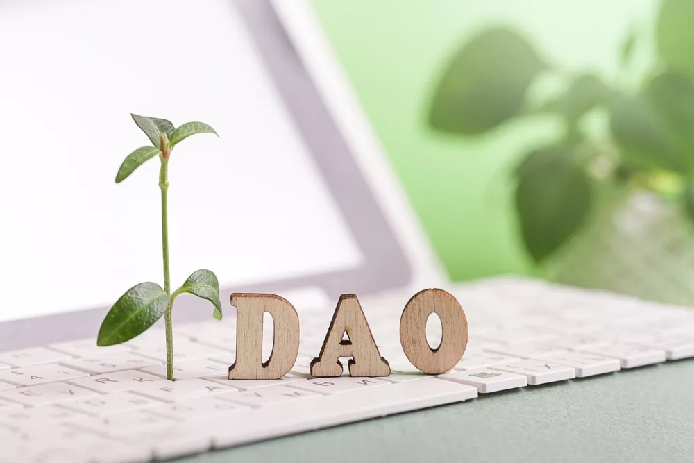 DAO is spelled on a keyboard to depict decentralized autonomous organization.