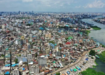 A city with many buildings and a body of water, reminiscent of the bustling urban centers where Bangladesh crypto communities thrive.