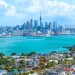 Scenic image of Auckland showing the CBD in the background and water in front, used to illustrate an article about crypto usage in New Zealand.
